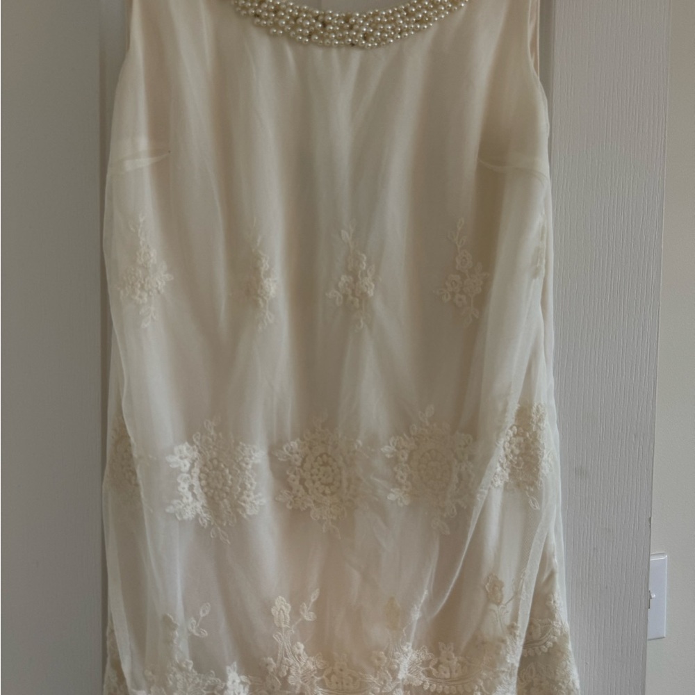 Elegant Ivory Sleeveless Dress with Pearl Neckline